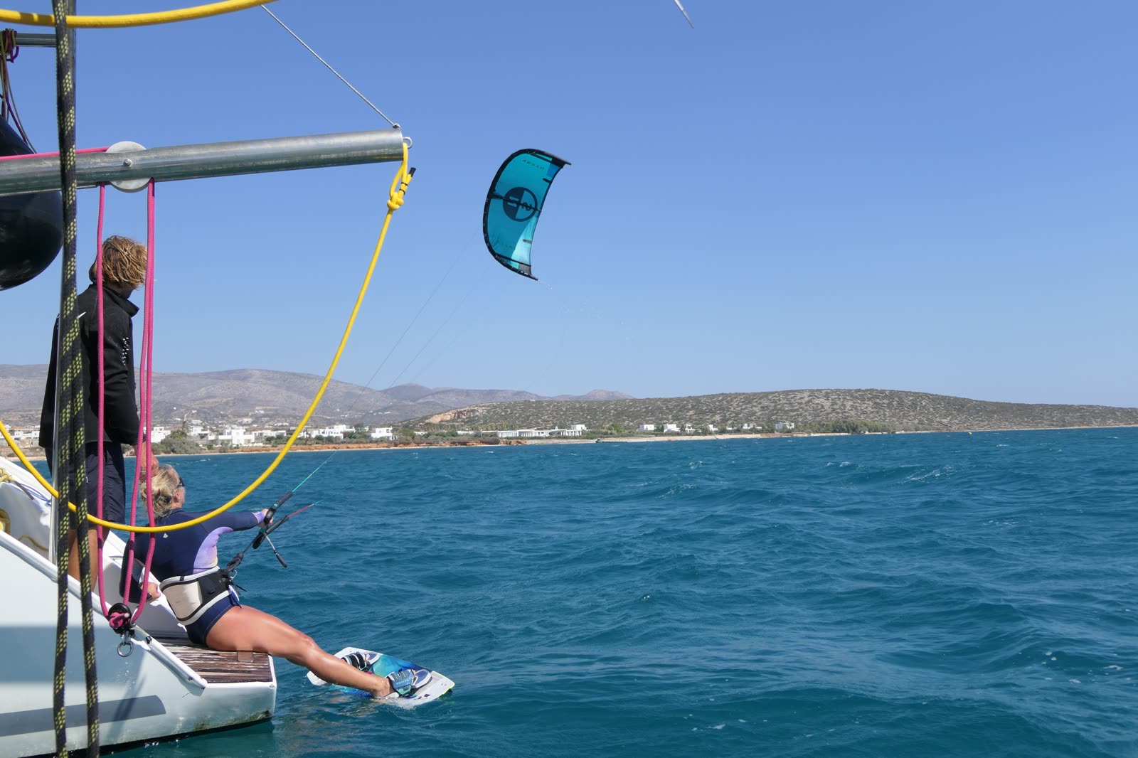 Tina preparing to launch her kiteboard from the boat